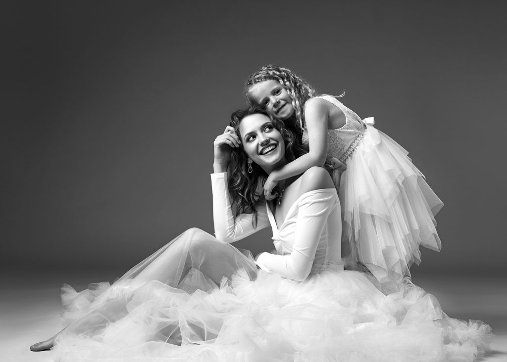 "Baby fotoshoot en familiefotografie met pasgeboren fotografie tijdens een liefdevolle newborn fotoshoot in een warme setting."